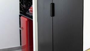 A room with a dark wooden wardrobe, a red appliance, and a marble countertop. - Kristy's 360 view elegant rooftop flat (Zografou)