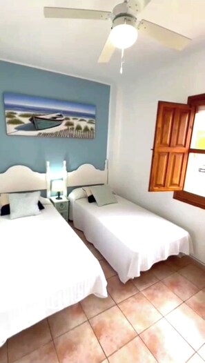 2 dormitorios, tabla de planchar con plancha, wifi gratis y ropa de cama
