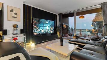 Luxury Apartment, Beach View | Living area | Flat-screen TV, DVD player, computer monitors