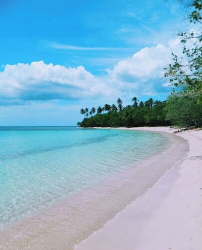 Villa Tucan Tropical Getaway just steps from Buye Beach & pool.