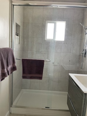 Shower, hair dryer, towels, soap
