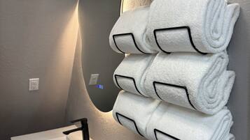 Hair dryer, towels, soap, toilet paper