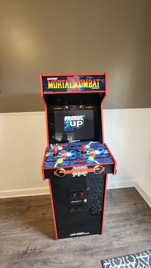 A Midway arcade machine with Mortal Kombat II, featuring a joystick and buttons, set against a plain wall. - Newly Renovated 2 bedroom, Swimming Pool, Hottub, Dog Friendly (Lower Township)