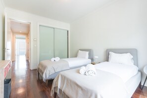 A hotel room with two beds, a desk, and a wardrobe. - La Belle Vie by Atlantic Holiday (Funchal)