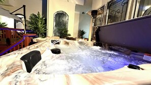 A hot tub with water jets, a wooden deck, and indoor plants. - This beautiful Luxury Mini Mansion,  4 bedroom 4 bath estate in Atlanta GA. (Atlanta)