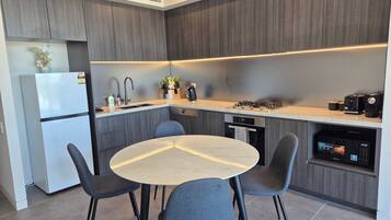 Coffee/tea maker, fridge, microwave, oven