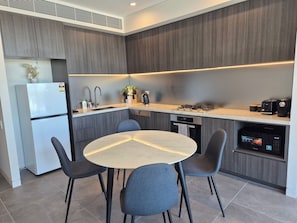 Fridge, microwave, oven, stovetop - Olympic Park 1BR: Pool | Gym | Free Secure Parking (Lidcombe)