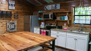 Microwave, oven, stovetop, toaster - Riverfront Cabins  and  Vacation Homes (Rio Frio)