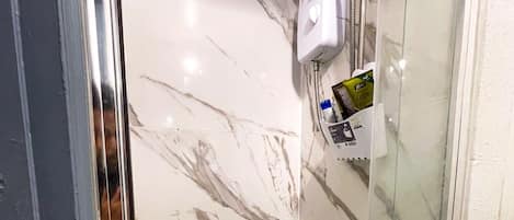 Shower, hair dryer, towels, soap