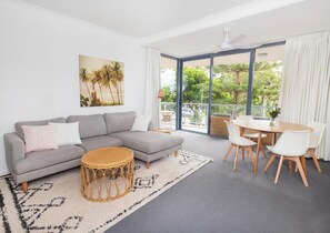 Superior Apartment, Balcony | Living area | 55-inch flat-screen TV with digital channels - Swell Resort Burleigh Heads (Burleigh Heads)