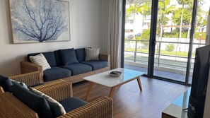 Standard Apartment, Balcony | Living area | 55-inch flat-screen TV with digital channels - Swell Resort Burleigh Heads (Burleigh Heads)