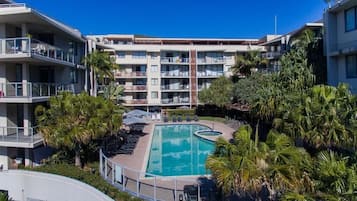 2 outdoor pools, open 8:00 AM to 9:00 AM, pool umbrellas, pool loungers