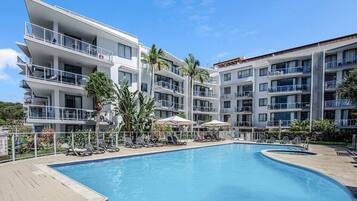 2 outdoor pools, open 8:00 AM to 9:00 AM, pool umbrellas, pool loungers