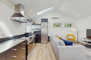 Fridge, microwave, oven, stovetop - Light-filled house with private deck, fast downtown access, free street parking (Seattle)