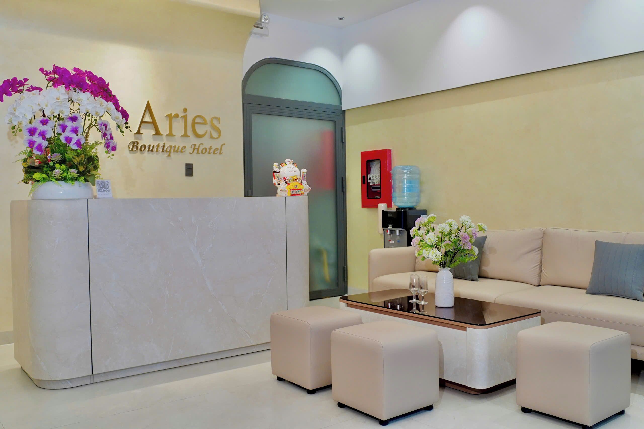A reception area with a marble reception desk, a sofa, and a coffee table.