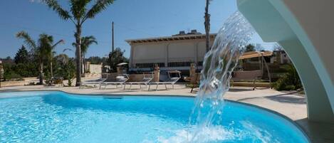 Seasonal outdoor pool, pool umbrellas, pool loungers