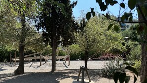 A playground with swings and a seesaw. - AthensView Skyline: 5th fl, 2BR, Acropolis View (Athina)