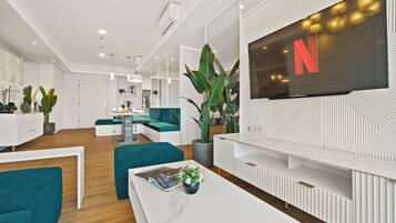 Apartment, 3 Bedrooms, City View | Living room | 50-inch Smart TV with cable channels, Netflix, streaming services