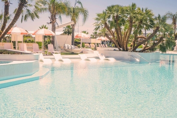 Outdoor pool, open 8:00 AM to 10:00 PM, free cabanas, pool umbrellas