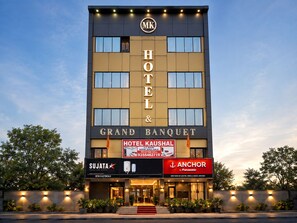 A hotel building with a prominent sign for 'HOTEL KAUSHAL' and 'GRAND BANQUET' at the top. - Hotel Kaushal (Ghaziabad)