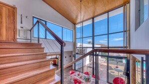 A modern staircase leading to a balcony with a clear view of the outside. - Villa El Erizo • Pool • LVH (Nazaret)