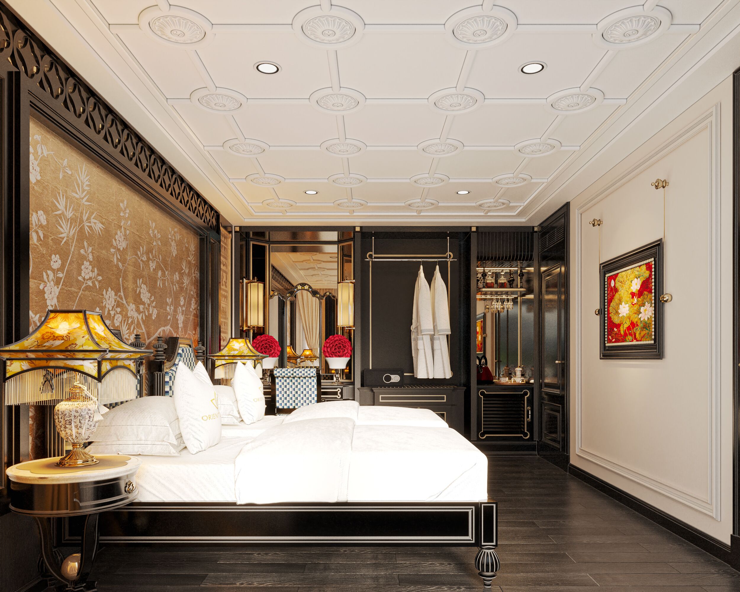 A spacious hotel room with a large bed, a sitting area with a table and lamps, a wardrobe, and a bathroom visible through an open door.