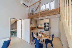 Dining - Two new, adjoining lofts in a former cannery: terraces and parking. (Saintes)