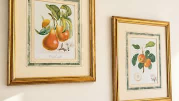 Two framed botanical prints on a wall.