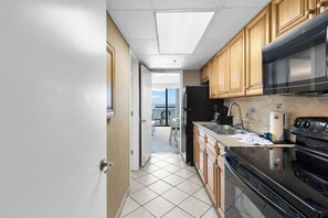 Comfort Condo, 1 Bedroom, Balcony, Ocean View | Private kitchen | Fridge, microwave, oven, stovetop - Caribbean Resort 732 (Myrtle Beach)