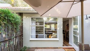 A small room with a window, a door, and a view of the outside. - Rosario’s Village | 2-Bed Unit 09, Bryanston (Bryanston)