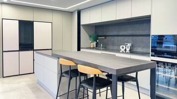 Family Double Room, Multiple Beds, Sea View | Private kitchen | Shared fridge, microwave, highchair