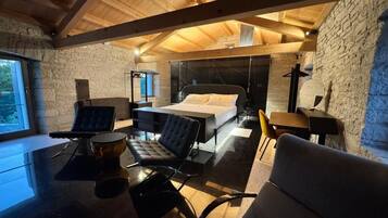 Suite, 1 King Bed | In-room safe, blackout drapes, soundproofing, free WiFi