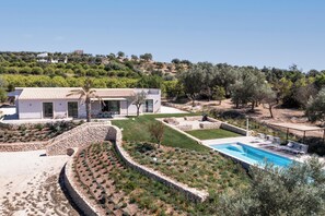 A modern villa with a swimming pool, terraced garden, and a view of the surrounding hills. - Villa Maddalena - Three Bedroom Villa, Sleeps 6 (Noto)