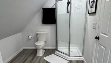 Shower, towels, soap, toilet paper