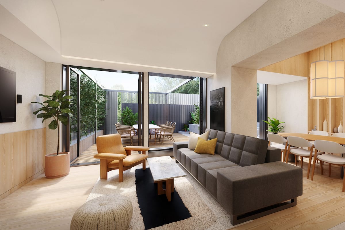 A modern living room with a sofa, chairs, a dining table, and a TV mounted on the wall.