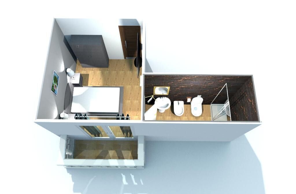 Habitación de hotel moderna con baño, zona de comedor y vistas al exterior.