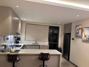 Deluxe Apartment | Private kitchen - Apartments at Abrish by Karibu Stays (Kampala)