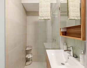 Shower, hair dryer, towels, soap
