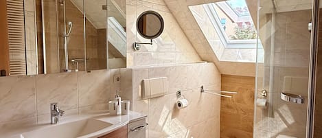 Shower, hair dryer, towels, toilet paper