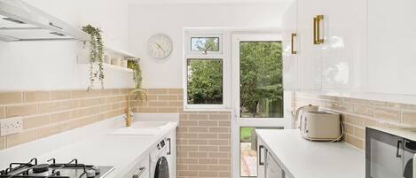 Fridge, microwave, stovetop, coffee/tea maker
