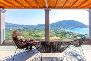 A balcony with a view of a mountainous landscape and a body of water. - Special Offer - Villa With Private Pool (Lefkada)