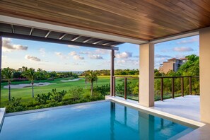 A pool with a view of a golf course and a building. - 3bed Condo- Private Pool Golf Cart Ocean View HK Las Marietas F101 (Punta de Mita)