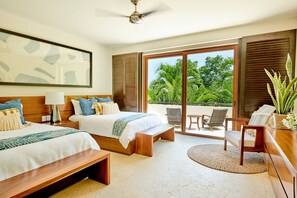 A hotel room with two beds, a ceiling fan, a large window with a view of palm trees, and a small balcony with seating. - Condo Los Arboles -hsk 6 Seater Golf Cart Included (Punta de Mita)