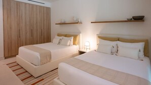A hotel room with two beds, a wardrobe, bedside tables, and wall-mounted shelves. - Naya 6301 Tower VI in Punta De Mita (Punta de Mita)