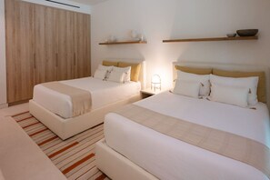 A hotel room with two beds, a wardrobe, bedside tables, and wall-mounted shelves. - Naya 6301 Tower VI in Punta De Mita (Punta de Mita)