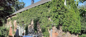 A house with a heart by the stream of peace