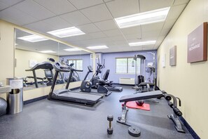 A gym with treadmills, elliptical machines, and free weights. - Saint Joseph Inn & Suites Benton Harbor Near I-94 (Benton Harbor)