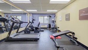 A gym with treadmills, elliptical machines, and weightlifting equipment. - Saint Joseph Inn & Suites Benton Harbor Near I-94 (Benton Harbor)