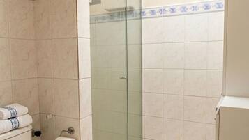 Shower, hair dryer, towels, toilet paper