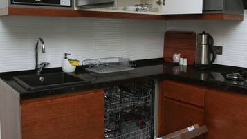 Family Apartment, Balcony, Pool View | Private kitchen | Full-size fridge, microwave, stovetop, dishwasher